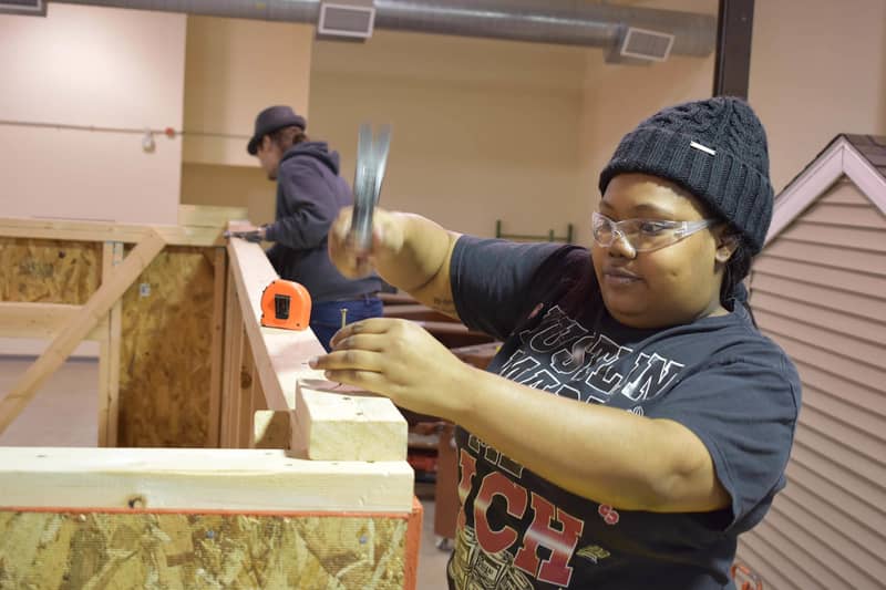 black woman hammering